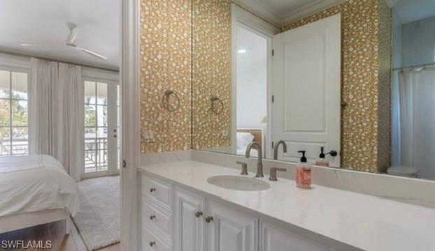 428 Rudder Road Naples, FL 34102 - Photo 43 of 49 a bathroom with a sink and a mirror