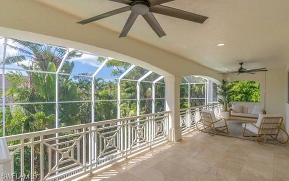 428 Rudder Road Naples, FL 34102 - Photo 48 of 49 a view of a balcony with chairs and potted plants