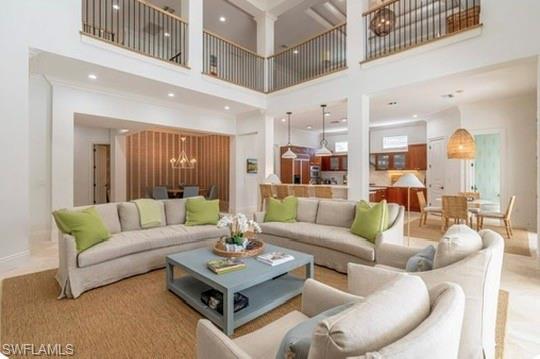 428 Rudder Road Naples, FL 34102 - Photo 10 of 49 a living room with furniture and a table