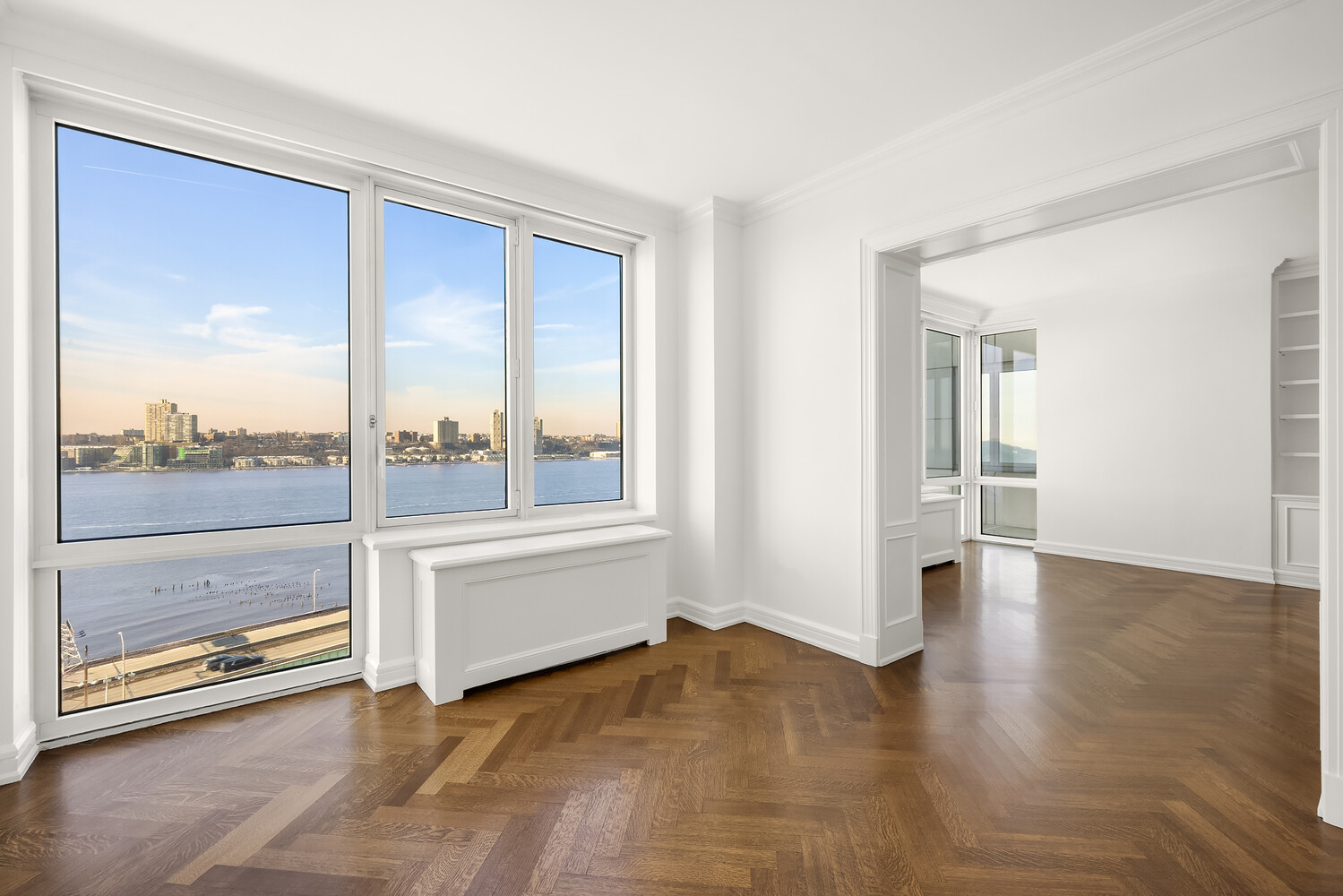 80 Riverside Boulevard, Unit 15B Manhattan, NY 10069 - Photo 6 of 26 wooden floor in an empty room with a window