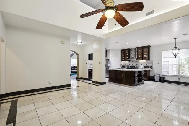 a view of kitchen with cabinets and window