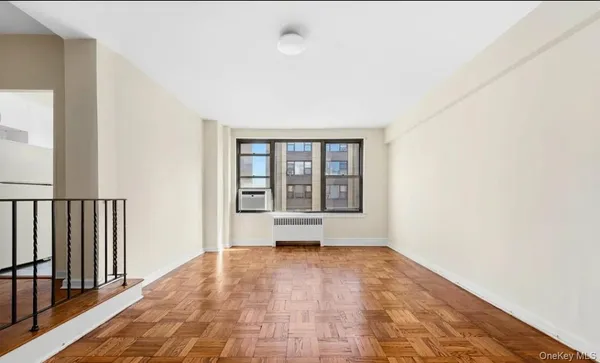 a view of an empty room and window