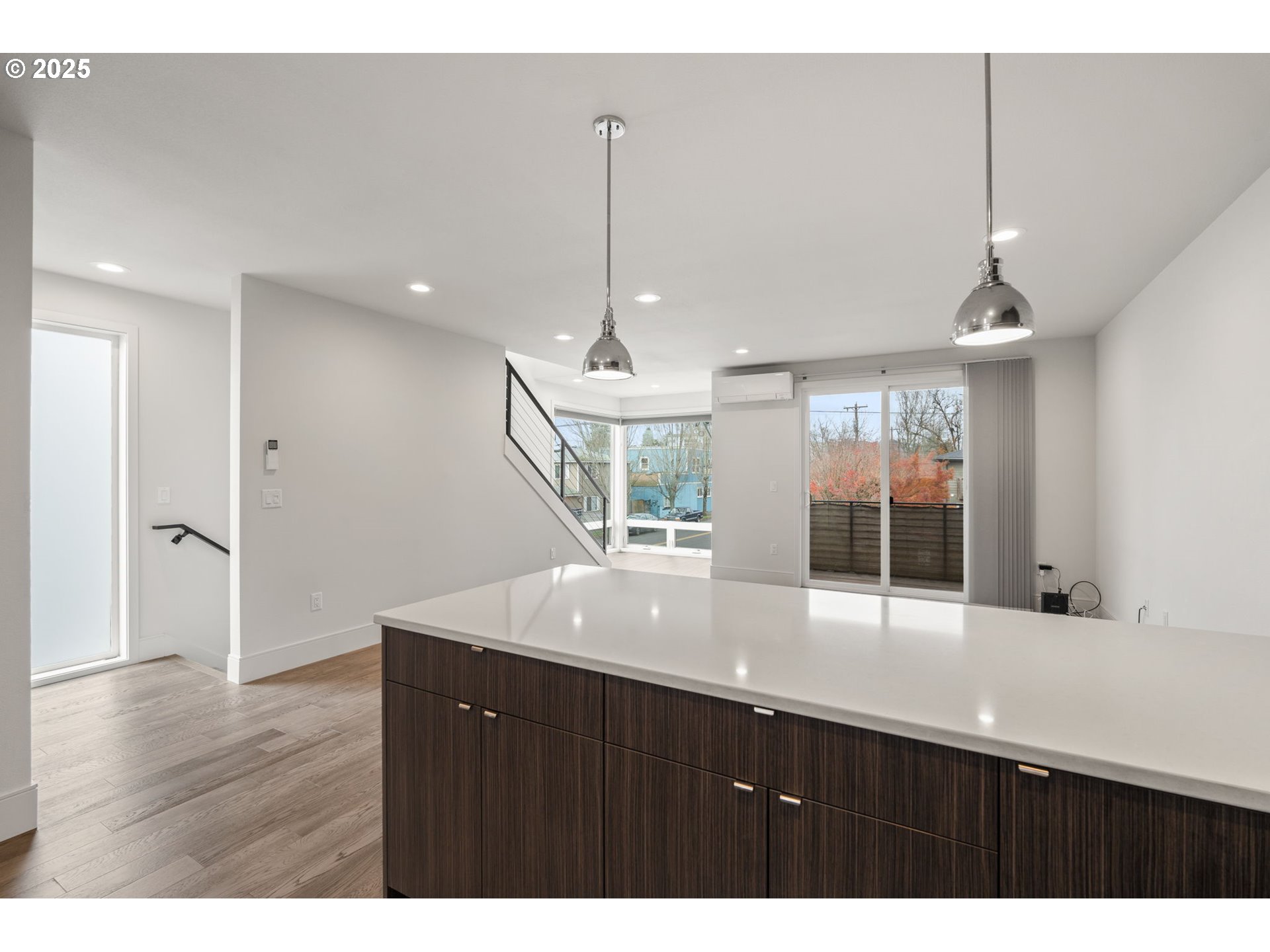 7204 Southeast Steele Street Portland, OR 97206 - Photo 12 of 37 a kitchen with kitchen island a counter top space appliances and a window