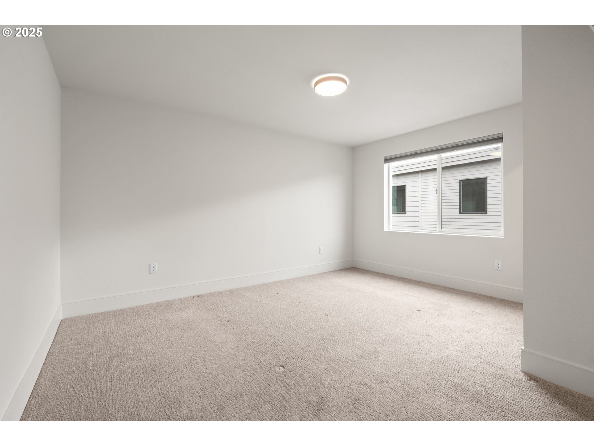 7204 Southeast Steele Street Portland, OR 97206 - Photo 16 of 37 a view of an empty room with a window