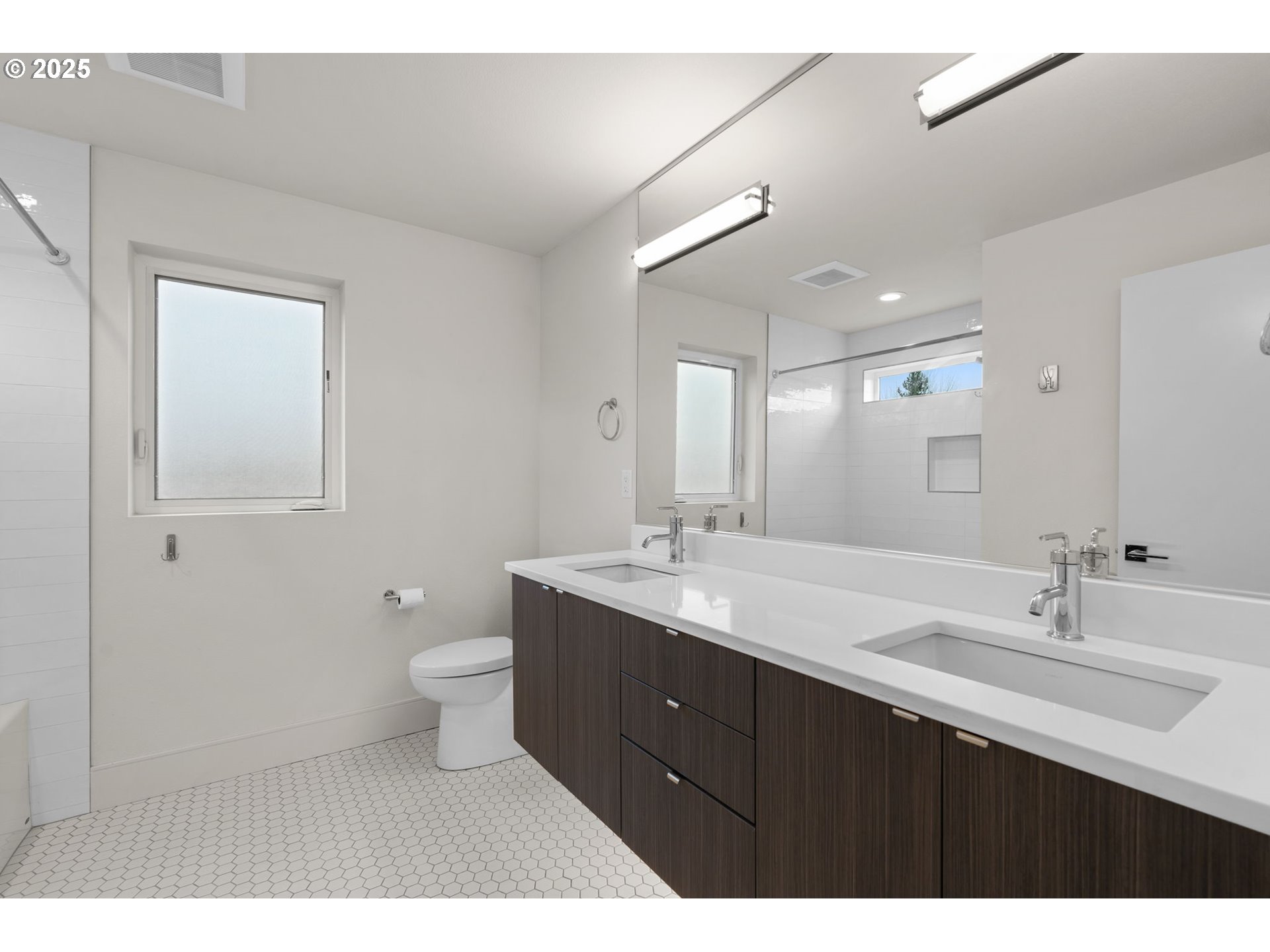 7204 Southeast Steele Street Portland, OR 97206 - Photo 20 of 37 a bathroom with a double vanity sink mirror and toilet