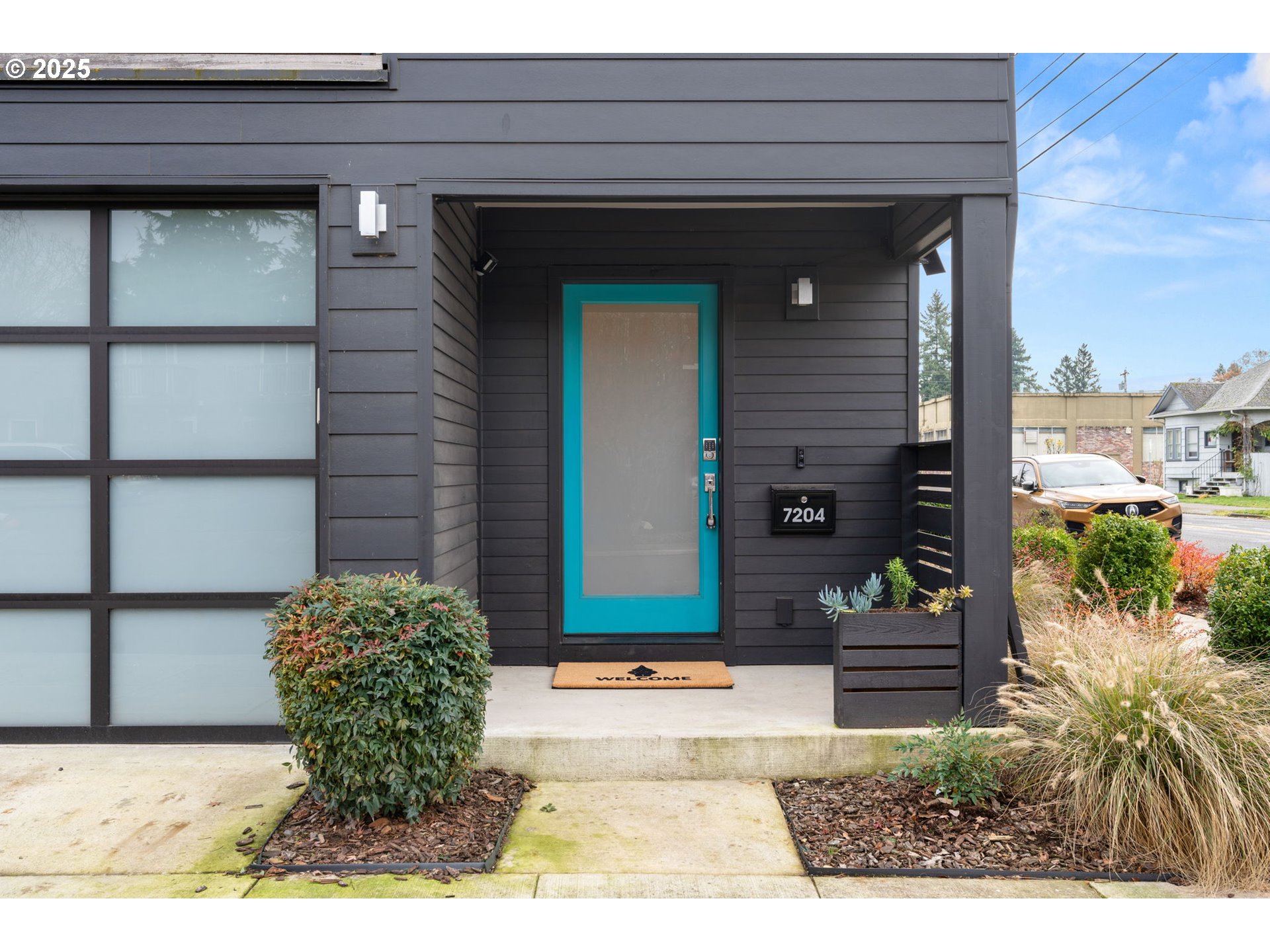 7204 Southeast Steele Street Portland, OR 97206 - Photo 3 of 37 a couple of potted plants in front of door
