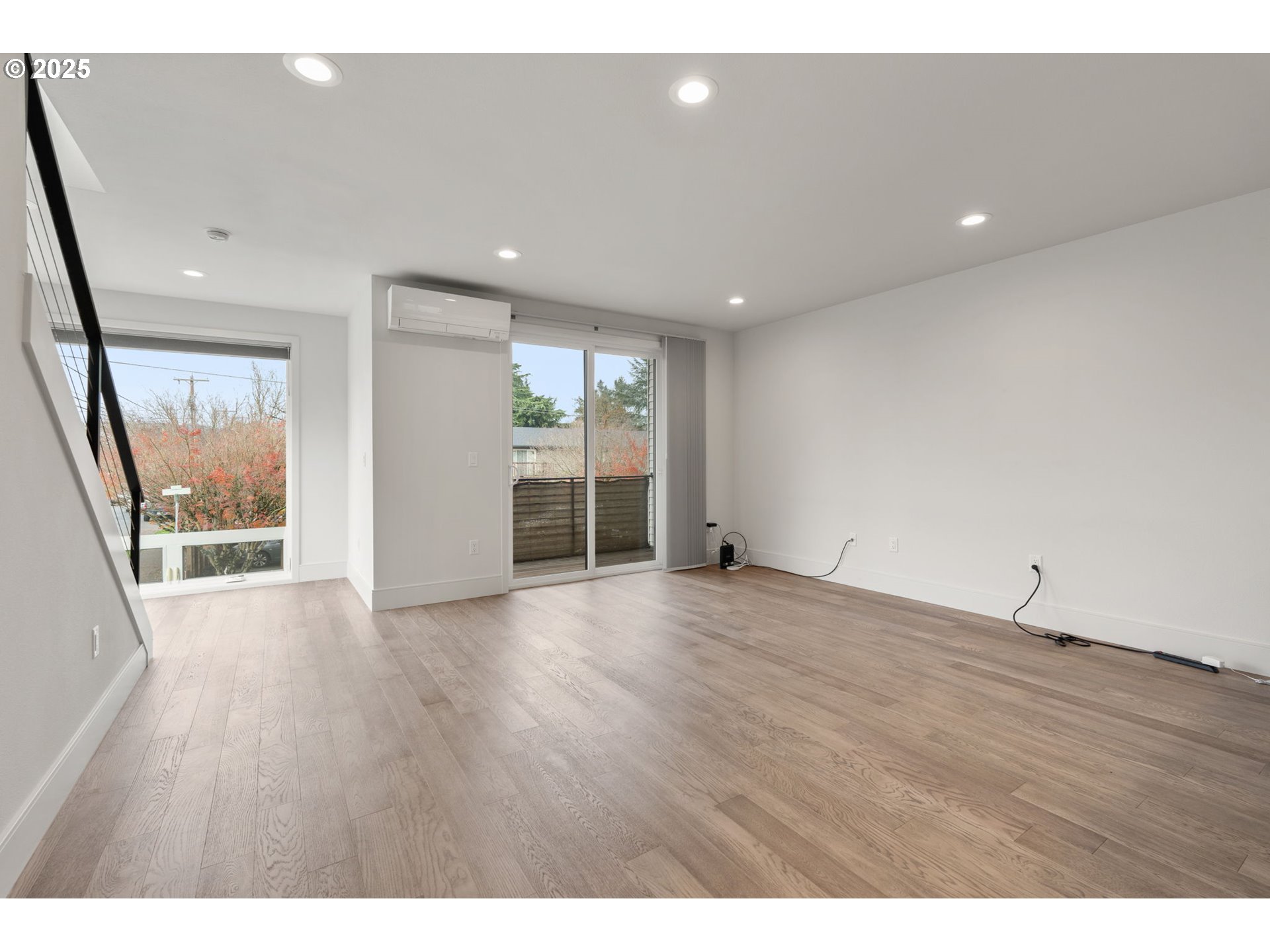 7204 Southeast Steele Street Portland, OR 97206 - Photo 5 of 37 a view of an empty room with wooden floor and a window