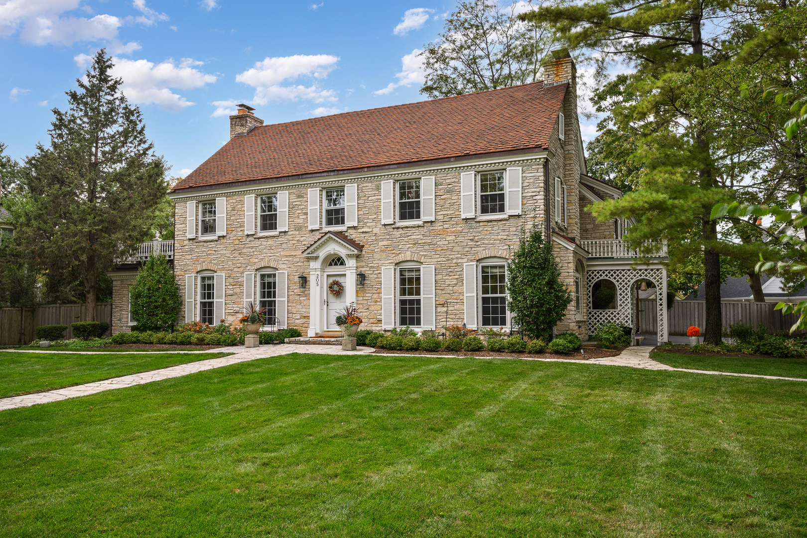 205 Scott Avenue Winnetka, IL 60093 - Photo 2 of 58 a front view of a house with a yard
