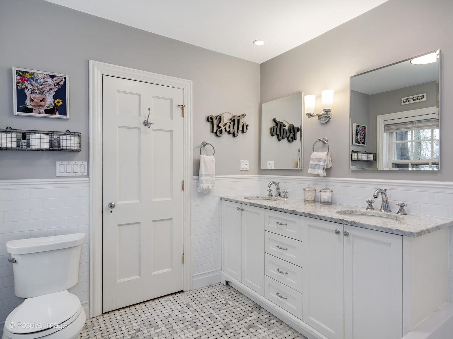 205 Scott Avenue Winnetka, IL 60093 - Photo 27 of 58 a bathroom with a toilet a sink and mirror