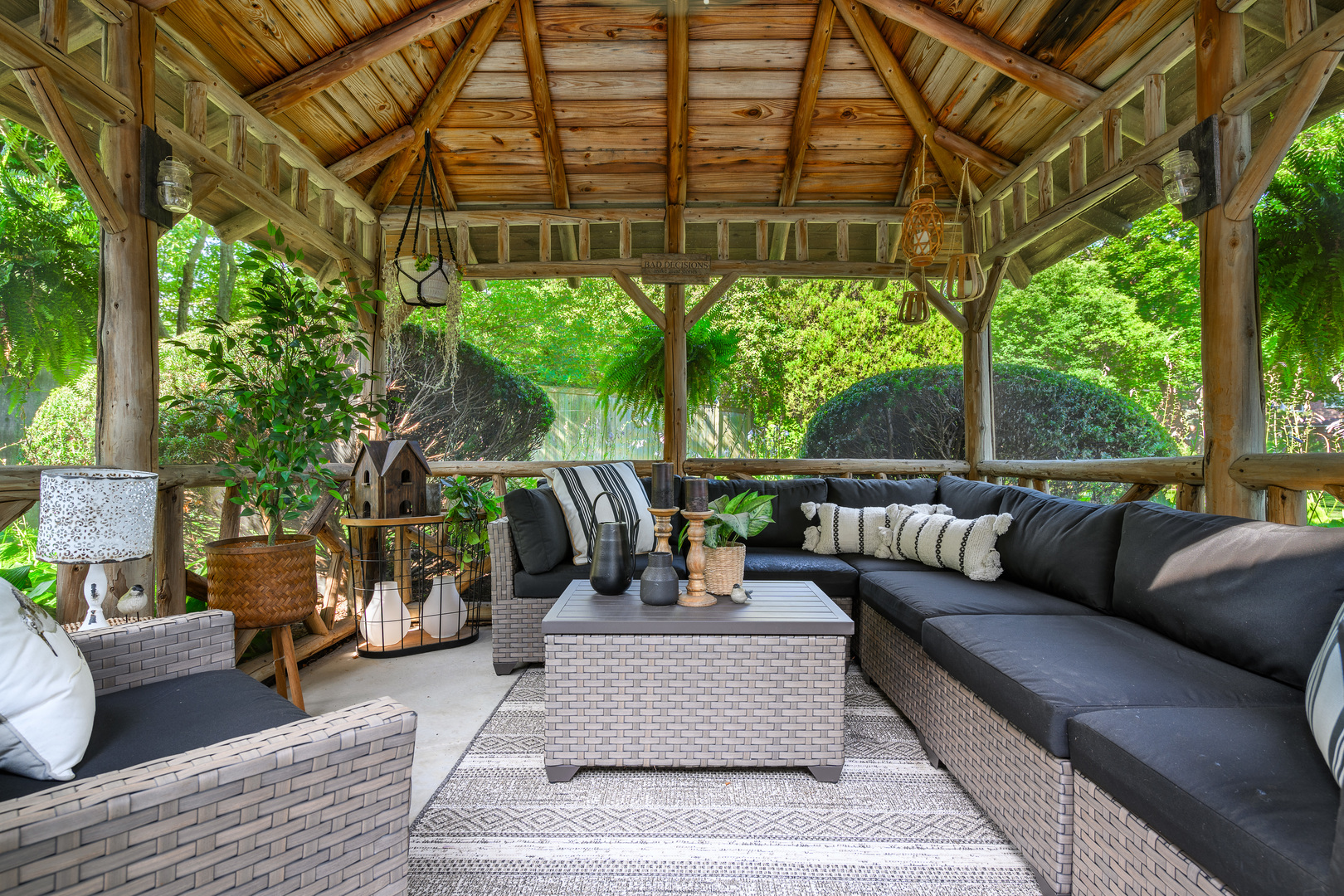 205 Scott Avenue Winnetka, IL 60093 - Photo 46 of 58 a view of a patio with couches and a table and chairs with wooden floor and fence