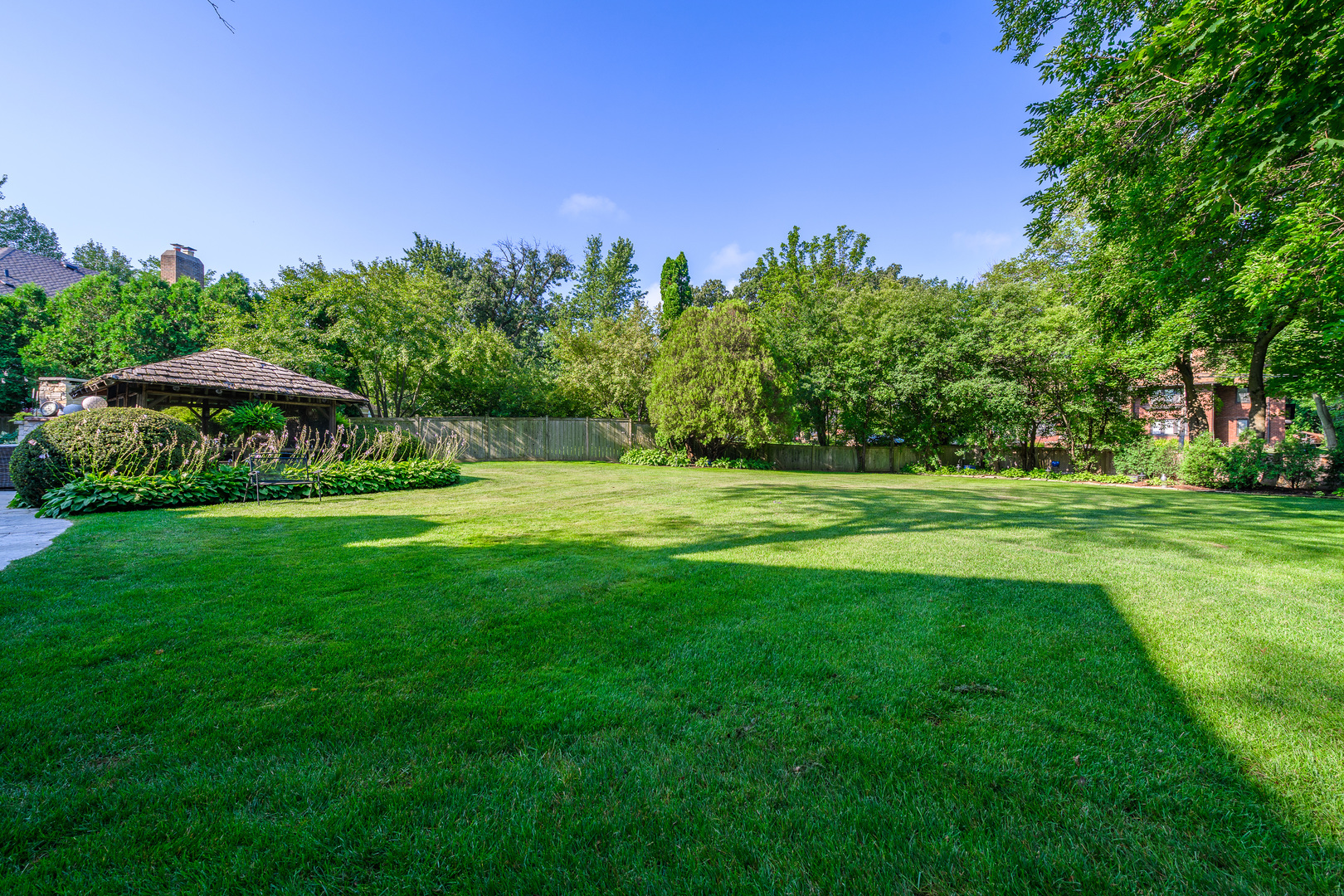 205 Scott Avenue Winnetka, IL 60093 - Photo 50 of 58 a view of a park with large trees and a plants