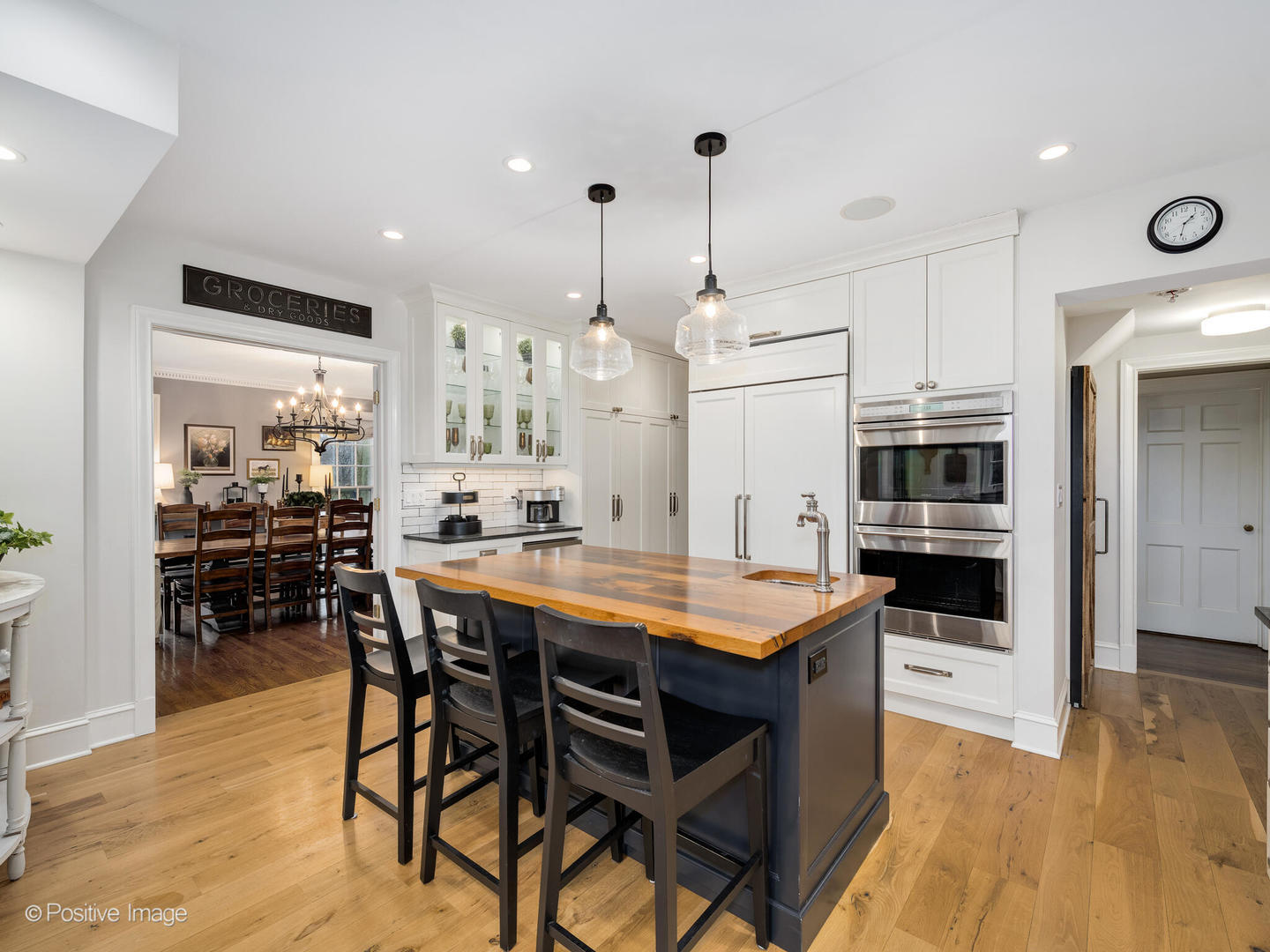 205 Scott Avenue Winnetka, IL 60093 - Photo 7 of 58 a kitchen with stainless steel appliances a dining table chairs stove and cabinets
