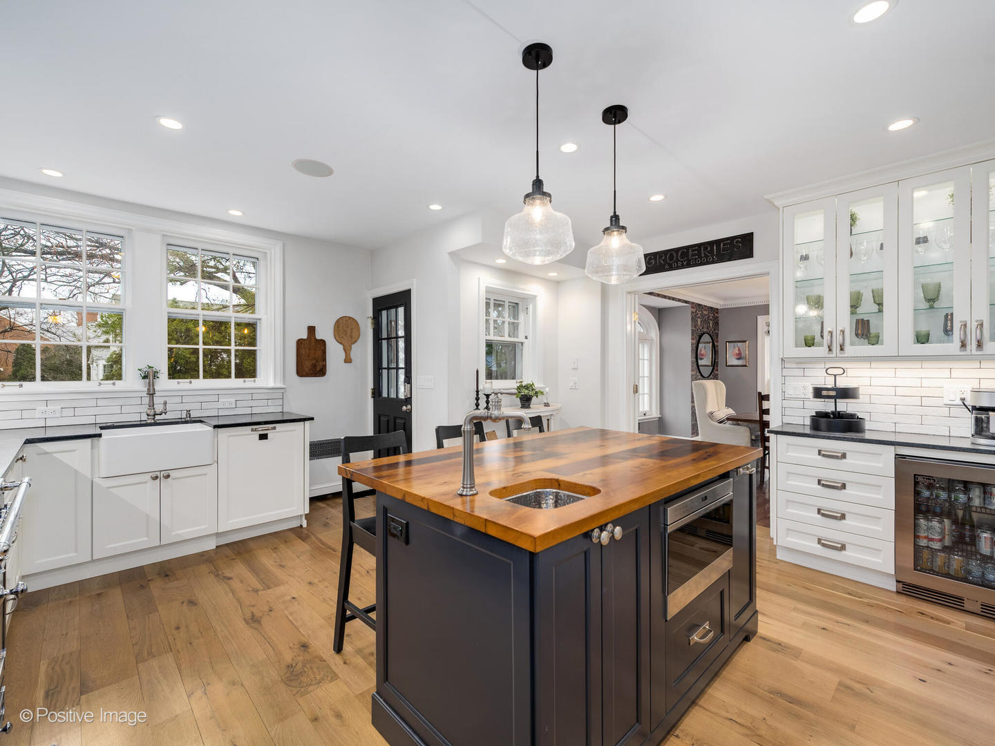 205 Scott Avenue Winnetka, IL 60093 - Photo 10 of 58 a kitchen with stainless steel appliances a stove a sink a oven a dining table and chairs
