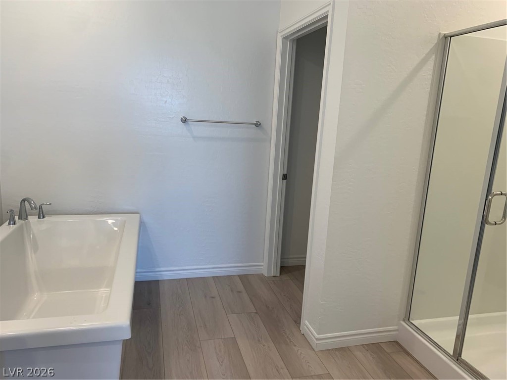 2555 Hampton Road, Unit 7109 Henderson, NV 89052 - Photo 21 of 34 Modern bathroom showcases clean lines with a sleek shower enclosure and a bright vanity.
