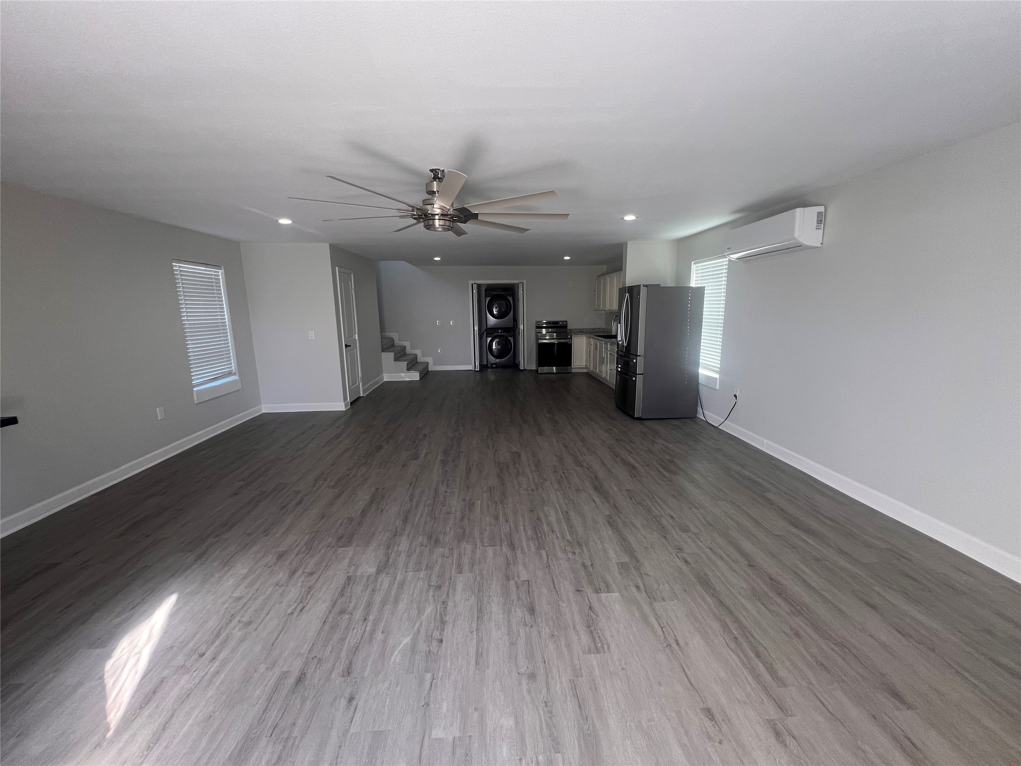 8110 Bullard Road Rosharon, TX 77583 - Photo 2 of 10 Bright and open with updated LVP flooring, recessed lighting, and fresh paint. Spacious enough for a living area, small home office, and dining space.