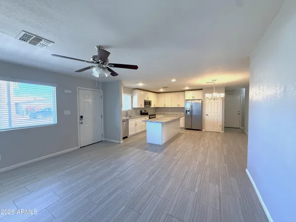 a view of kitchen with wooden floor and window