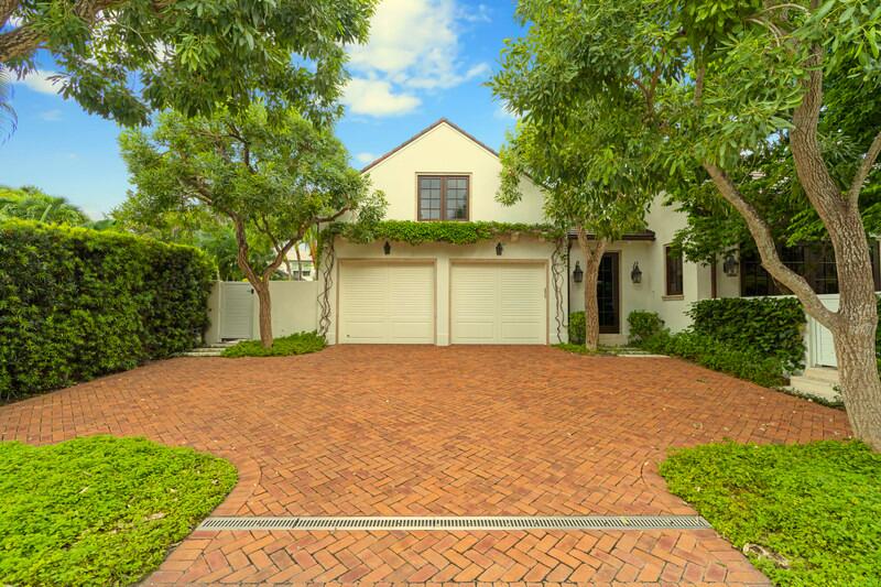 300 Indian Road Palm Beach, FL 33480 - Photo 6 of 17 a front view of a house with a yard and garage