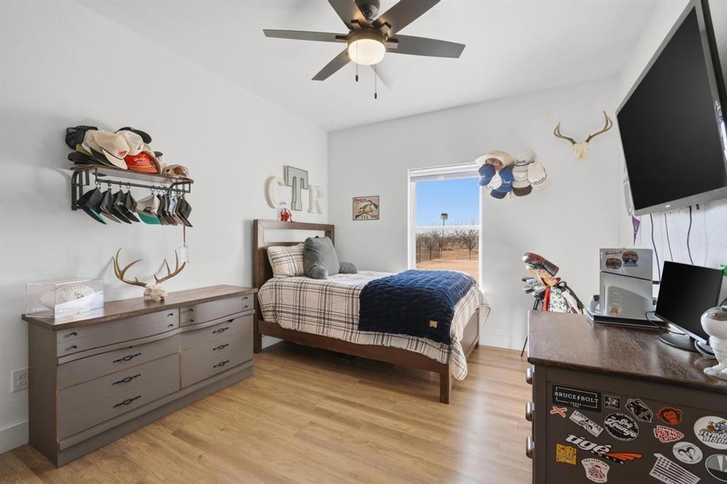 136 Mistletoe Ridge Lawn, TX 79530 - Photo 19 of 37 Bedroom featuring light wood-style floors and ceiling fan