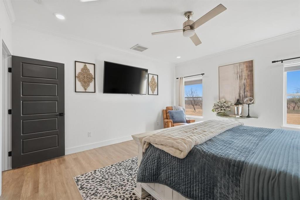 136 Mistletoe Ridge Lawn, TX 79530 - Photo 24 of 37 Bedroom featuring ornamental molding, light wood-style flooring, ceiling fan, and recessed lighting