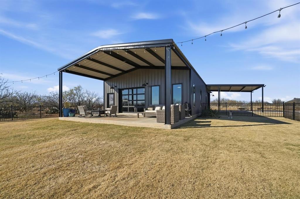 136 Mistletoe Ridge Lawn, TX 79530 - Photo 28 of 37 View of outdoor structure with an outdoor hangout area and a carport