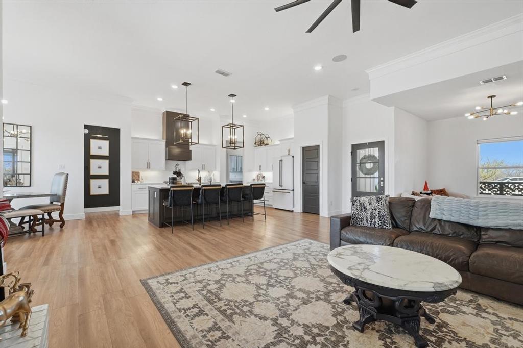 136 Mistletoe Ridge Lawn, TX 79530 - Photo 6 of 37 Living room, light wood-style flooring, ceiling fan, recessed lighting, and crown molding