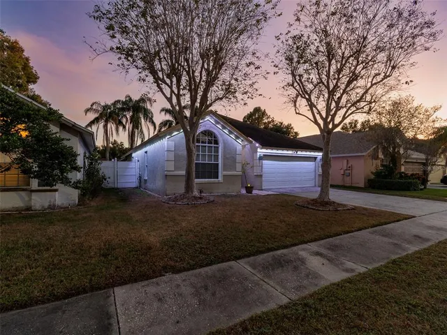 a view of a backyard with door and wooden floor