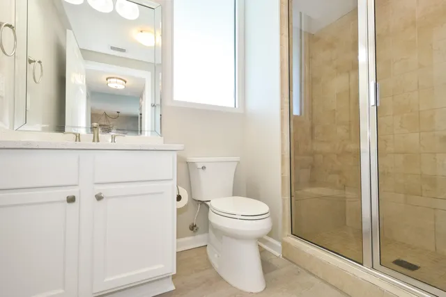 a bathroom with a sink and a mirror with toilet