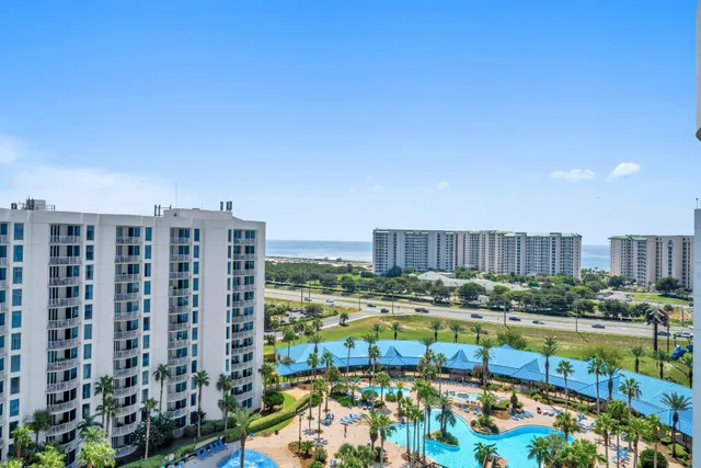 a view of swimming pool with a garden and outdoor seating