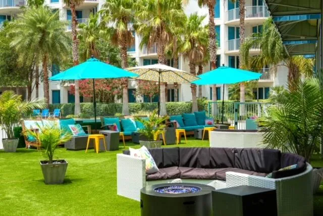 a view of an house with backyard and furniture