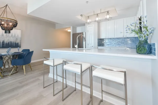 a kitchen with a table and chairs in it