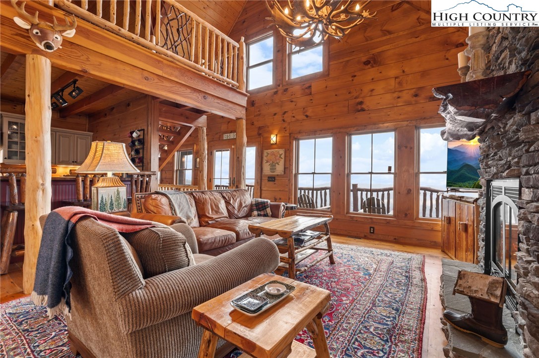 635 Acorn Road Zionville, NC 28698 - Photo 12 of 50 a outdoor living area with furniture and a rug