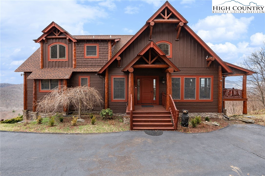 635 Acorn Road Zionville, NC 28698 - Photo 2 of 50 a front view of a house with a yard and garage