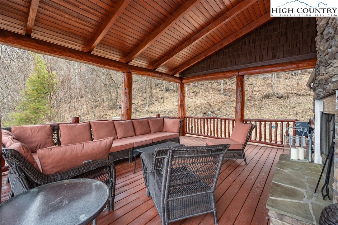635 Acorn Road Zionville, NC 28698 - Photo 21 of 50 a balcony with furniture and wooden floor