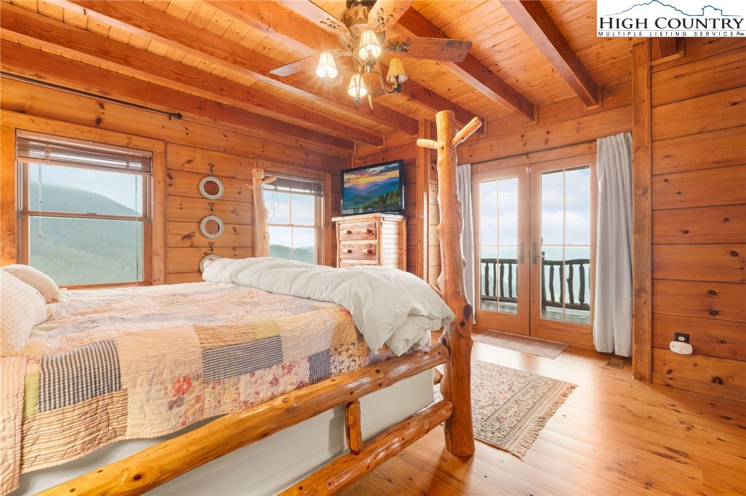 635 Acorn Road Zionville, NC 28698 - Photo 26 of 50 a bed sitting in a bedroom next to a window