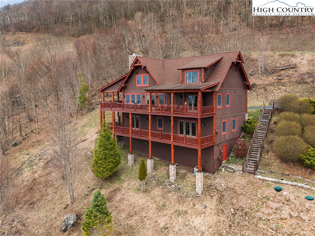 635 Acorn Road Zionville, NC 28698 - Photo 3 of 50 a front view of a house with a yard