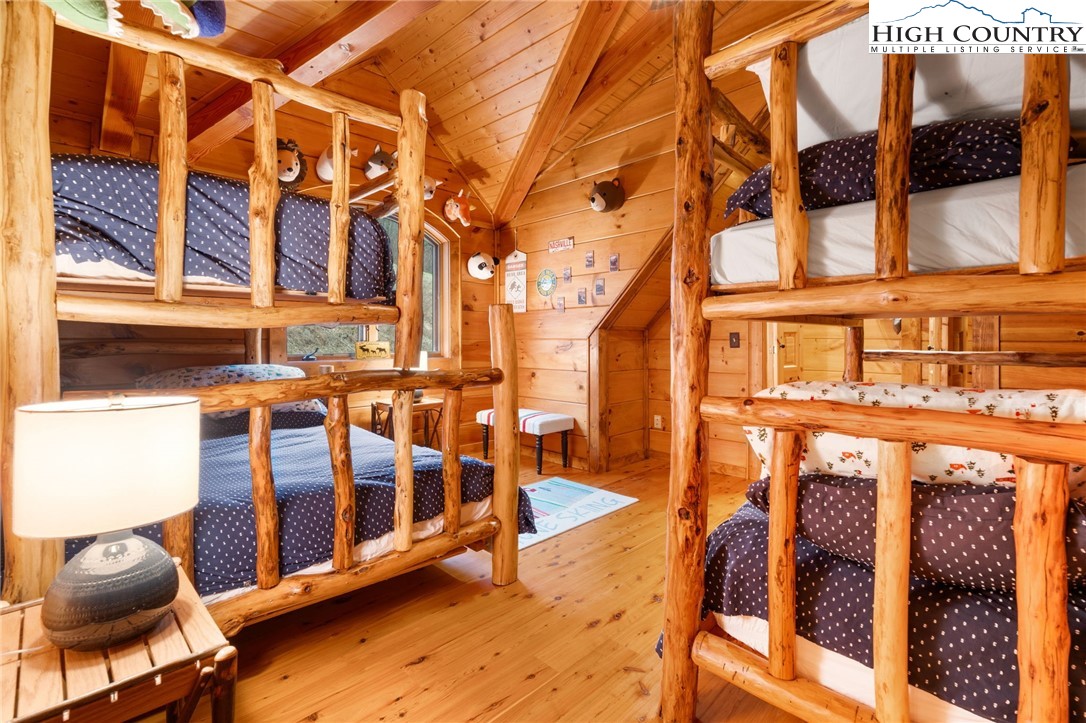 635 Acorn Road Zionville, NC 28698 - Photo 37 of 50 a view of a brick house with large windows and furniture