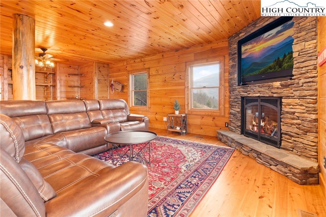 635 Acorn Road Zionville, NC 28698 - Photo 38 of 50 a living room with furniture and a fireplace