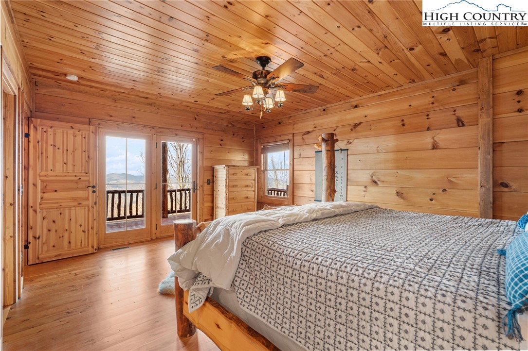 635 Acorn Road Zionville, NC 28698 - Photo 45 of 50 a bed sitting in a spacious bedroom next to a window