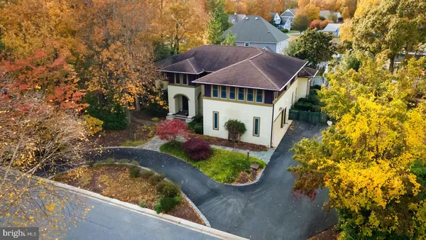 an aerial view of house with yard swimming pool and outdoor seating