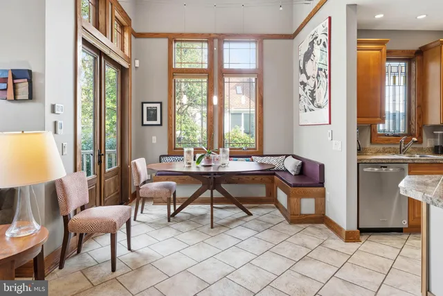 a bedroom with a large bed and a large window