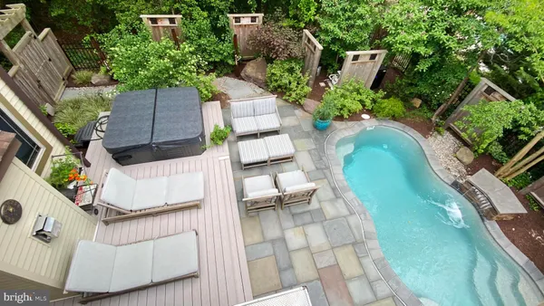 an aerial view of a house with outdoor space and sitting space