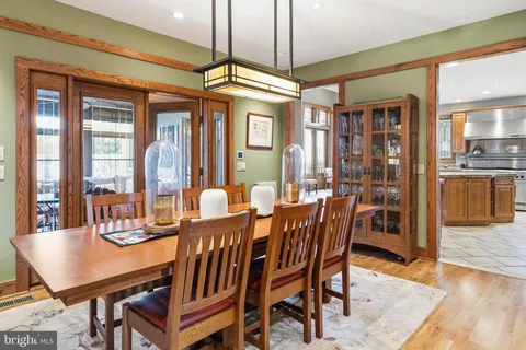 a living room with furniture and large windows