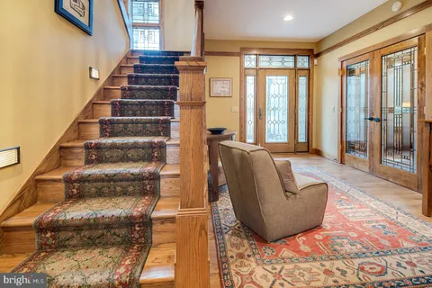 a bedroom with a large bed and a large window