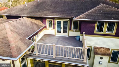 a bedroom with a bed dresser and a window