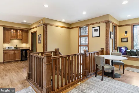 a view of a livingroom with furniture window and wooden floor