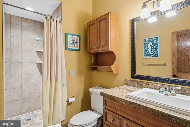 an aerial view of house with yard swimming pool and outdoor seating