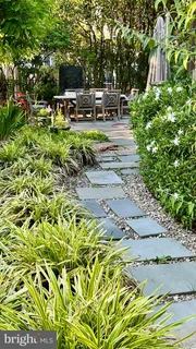 an aerial view of house with yard swimming pool and outdoor seating