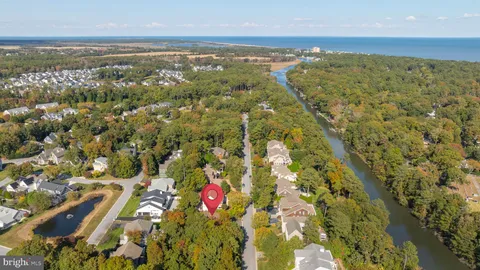 a view of a swimming pool and a yard