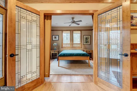 a bedroom with a bed and a window