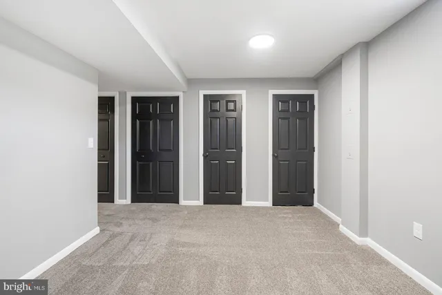 a bathroom with a sink vanity and a toilet